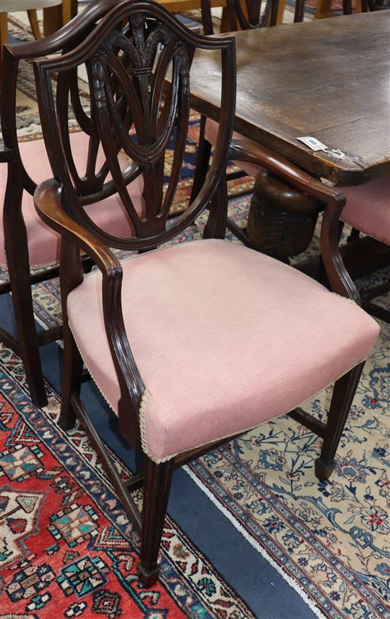 A set of eight Hepplewhite style mahogany dining chairs (two with arms)